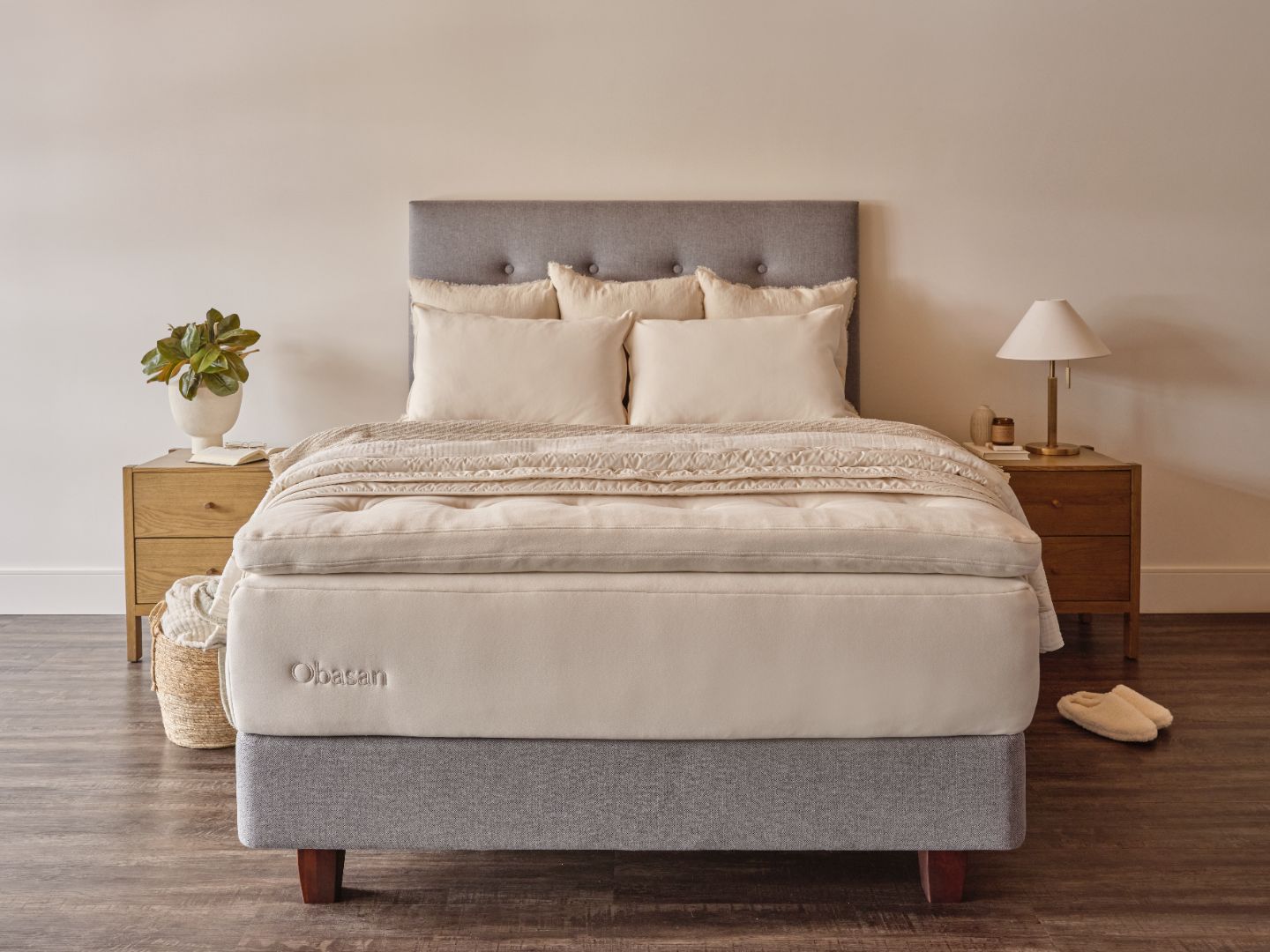 grand mattress styled with throw pillows and duvet